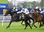 Horse race in progress as a black horse with number 4 leads a pack of jockeys on a green turf, blue and white silks flying. The Star Championships backdrop is visible.